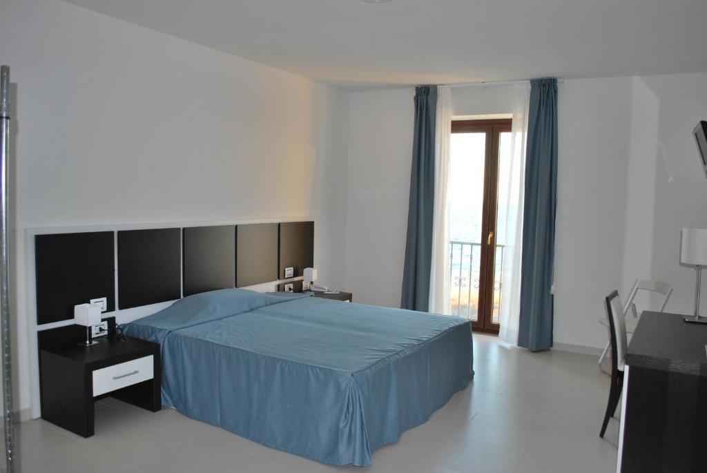 Buddi Hotel Platamona Habitación foto